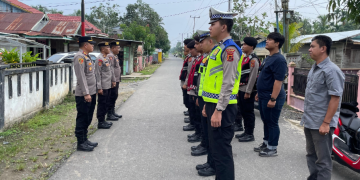 Personel Gabungan Polres Tanjab Barat dan Polsek Tungkal Ilir Amankan Pemilihan Kades PAW Desa Teluk Sialang Tahun 2026