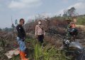 Ground Check Hotspot di Renah Mendaluh, Polsek Merlung Lakukan Pendinginan dan Pengawasan Lokasi Terbakar
